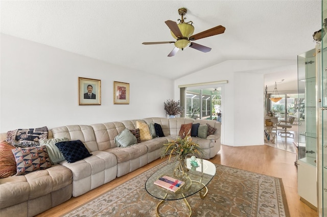 33 Poinsettia Ln, Palm Coast, FL 32164 - living room featuring vaulted ceiling, wood finished floors, and ceiling fan