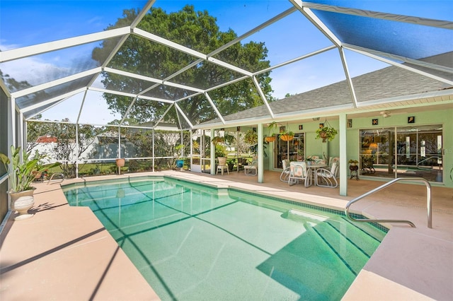33 Poinsettia Ln, Palm Coast, FL 32164 - swimming pool featuring a patio area, a ceiling fan, and a lanai