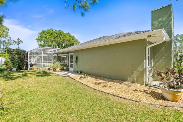 33 Poinsettia Ln, Palm Coast, FL 32164 - view of green lawn with a lanai