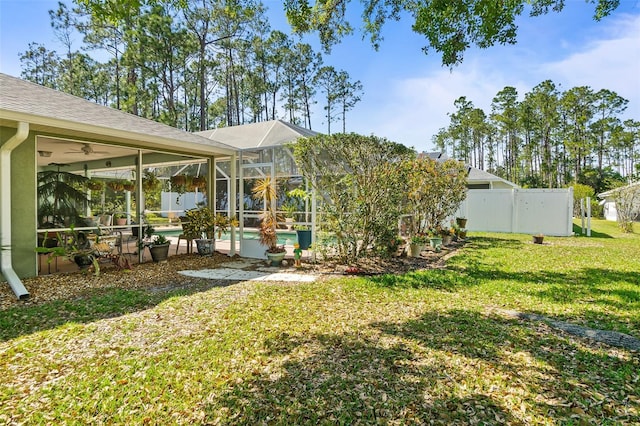 33 Poinsettia Ln, Palm Coast, FL 32164 - view of yard featuring an outdoor pool, a ceiling fan, and glass enclosure