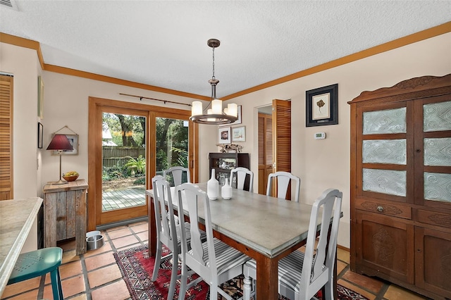 dining room featuring a chandelier and a textured ceiling