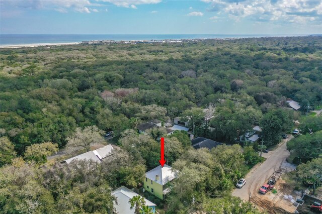 bird's eye view with a water view and a forest view