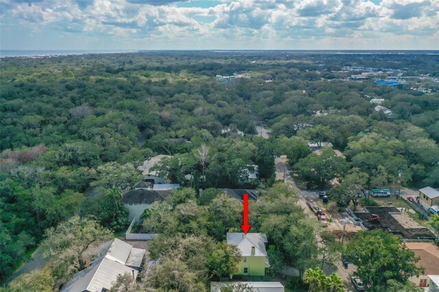 birds eye view of property with a wooded view