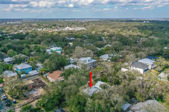 bird's eye view featuring a wooded view