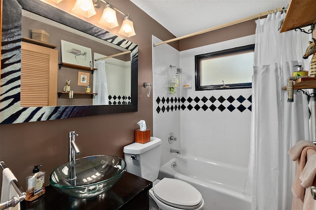 bathroom featuring shower / bath combination with curtain, a sink, and toilet