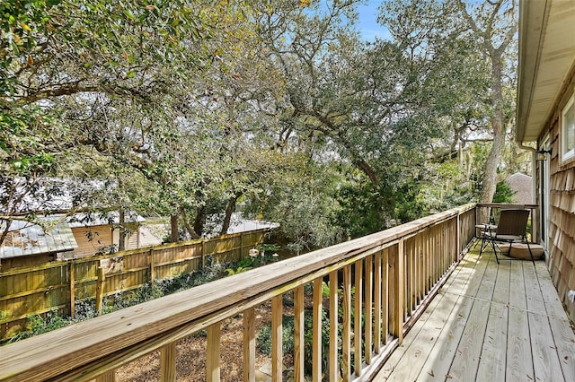 wooden deck featuring fence