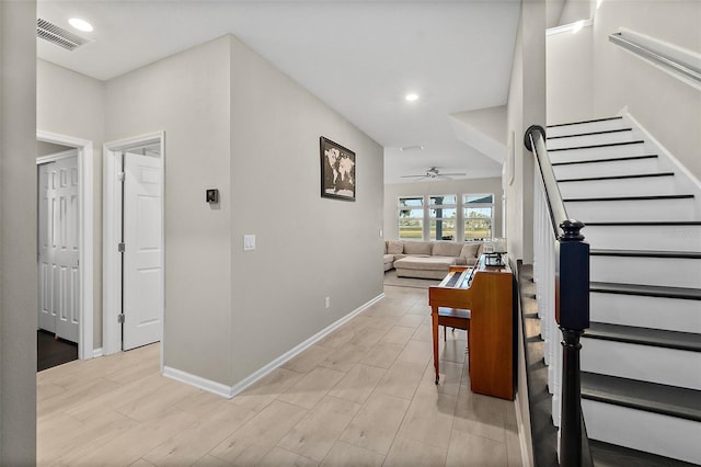 hall with baseboards, stairs, visible vents, and recessed lighting