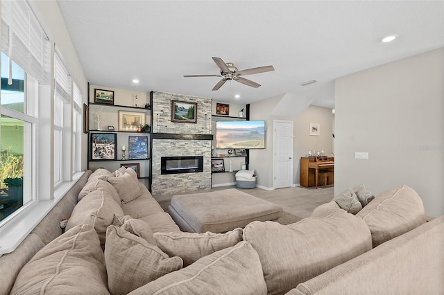 living area with recessed lighting, visible vents, ceiling fan, and a stone fireplace