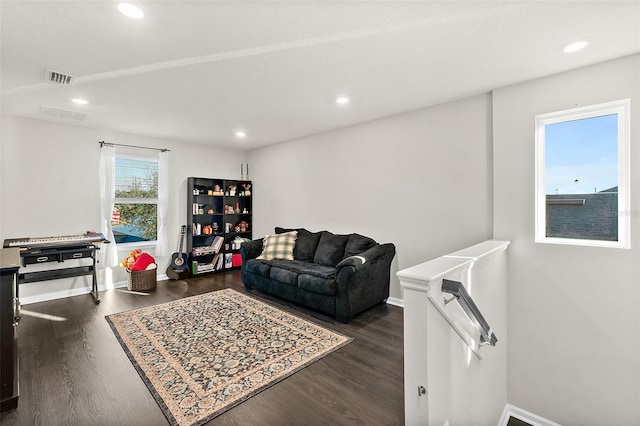 living area featuring visible vents, wood finished floors, and recessed lighting