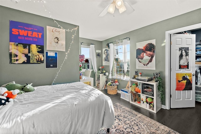 bedroom with ceiling fan and wood finished floors