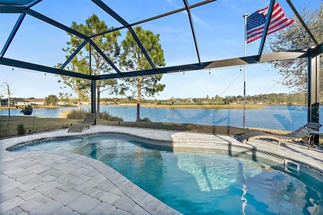 pool with a water view, a patio area, and glass enclosure