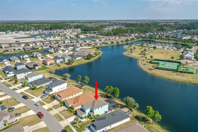 bird's eye view featuring a residential view and a water view