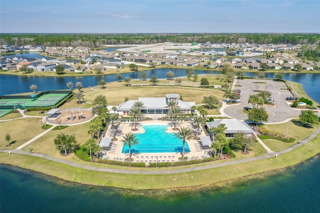 drone / aerial view featuring a water view and a residential view