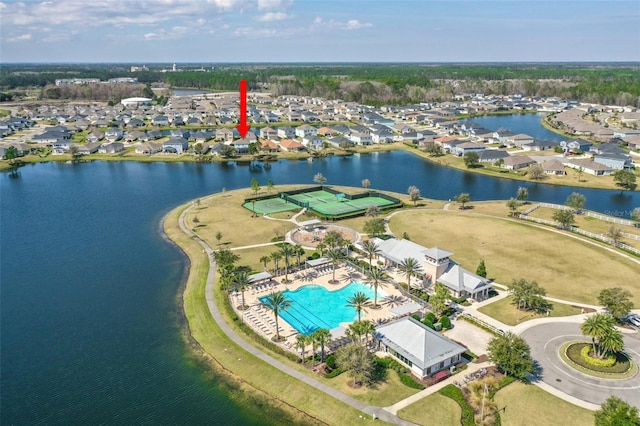 bird's eye view with a water view and a residential view