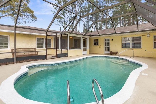 pool with a lanai and a patio