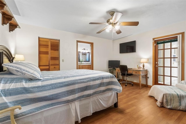 bedroom featuring baseboards, a ceiling fan, wood finished floors, ensuite bathroom, and a closet