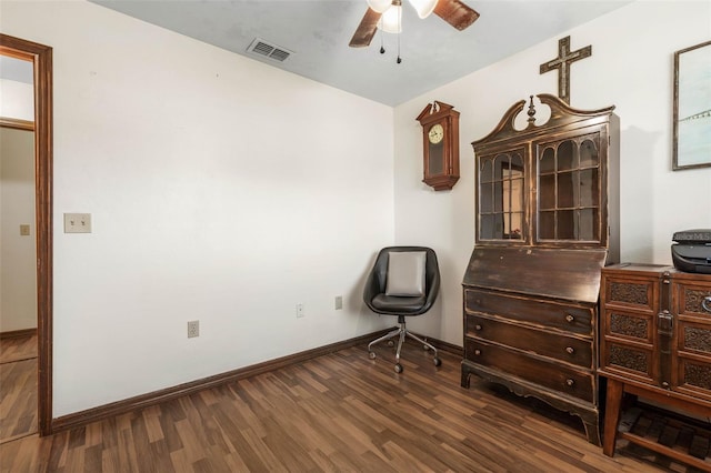 interior space with visible vents, ceiling fan, baseboards, and wood finished floors