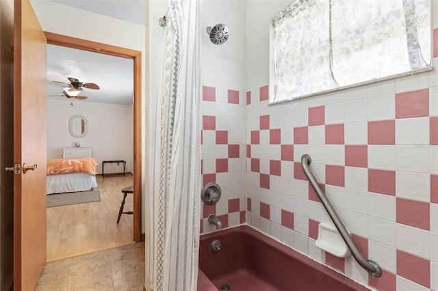 ensuite bathroom featuring ensuite bath, a ceiling fan, shower / tub combo with curtain, and tile patterned floors