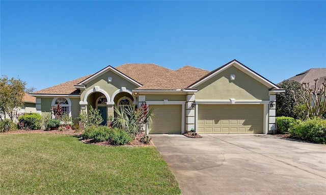 single story home featuring an attached garage, a front lawn, concrete driveway, and stucco siding