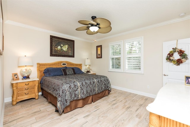 bedroom with light wood-style flooring, baseboards, and ornamental molding