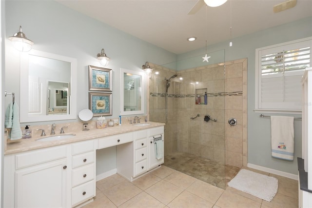 bathroom featuring tile patterned flooring, double vanity, walk in shower, and a sink