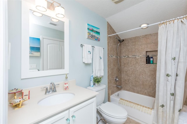 bathroom with visible vents, toilet, vanity, shower / bath combination with curtain, and a textured ceiling