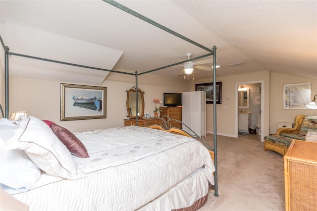 bedroom featuring visible vents, baseboards, lofted ceiling, a textured ceiling, and light carpet