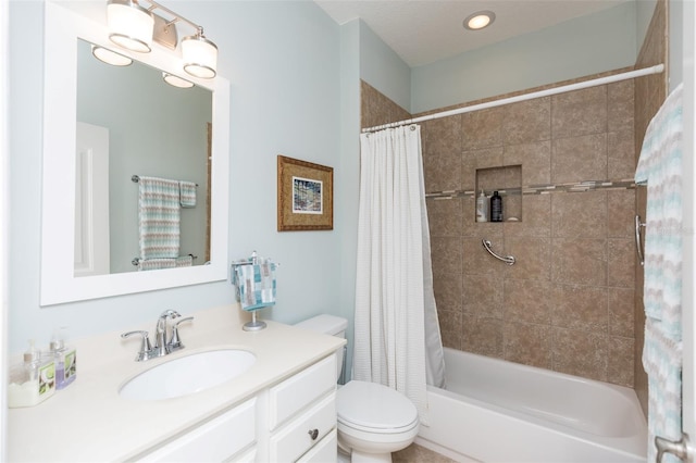 bathroom featuring shower / bath combination with curtain, toilet, and vanity