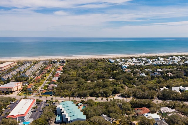 bird's eye view with a water view and a beach view