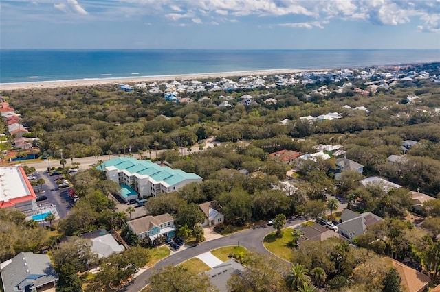 drone / aerial view with a beach view and a water view