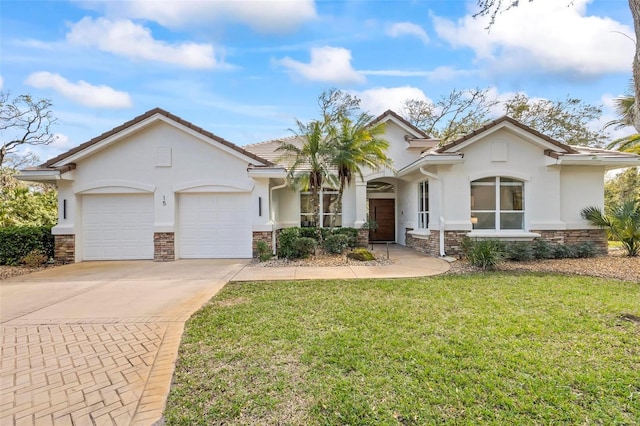 view of front of property with a garage, stone siding, driveway, and a front lawn