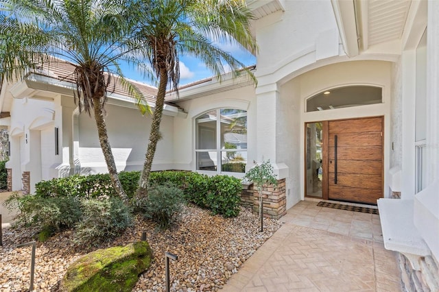 doorway to property with stucco siding