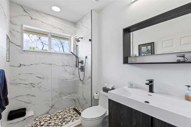 full bath featuring recessed lighting, toilet, vanity, and a marble finish shower