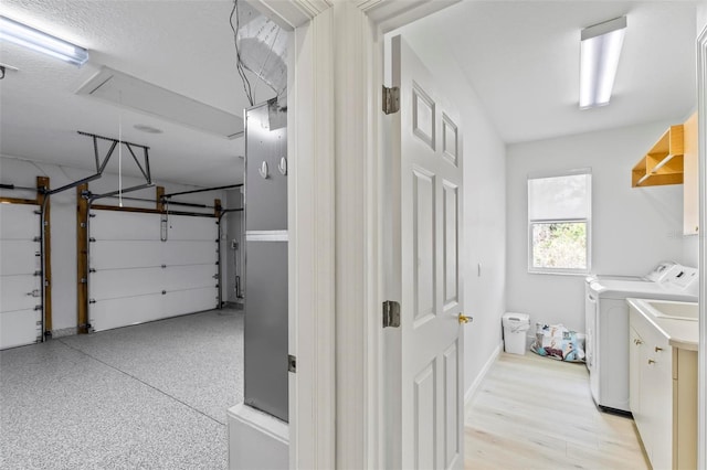 garage featuring washing machine and dryer