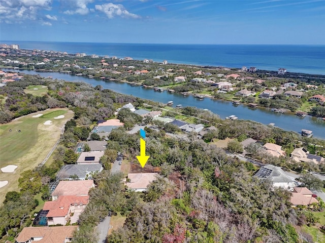 drone / aerial view featuring a residential view and a water view