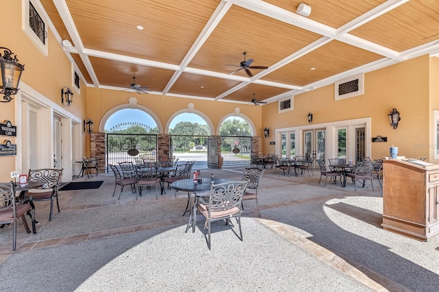 view of patio / terrace with fence, visible vents, a ceiling fan, french doors, and outdoor dining space