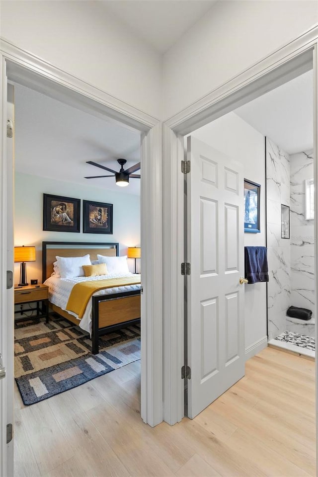 bedroom with a ceiling fan and light wood finished floors