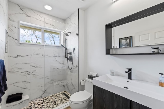 full bath featuring recessed lighting, a marble finish shower, toilet, and vanity