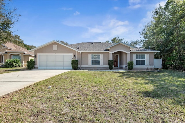 single story home with a garage, concrete driveway, a front yard, and stucco siding