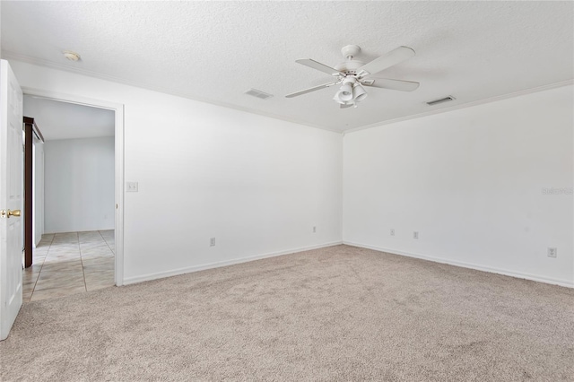 empty room with ceiling fan, a textured ceiling, visible vents, and light colored carpet