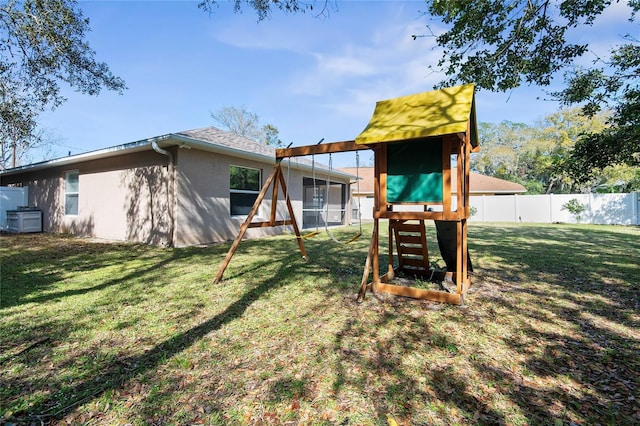 exterior space featuring fence and a lawn