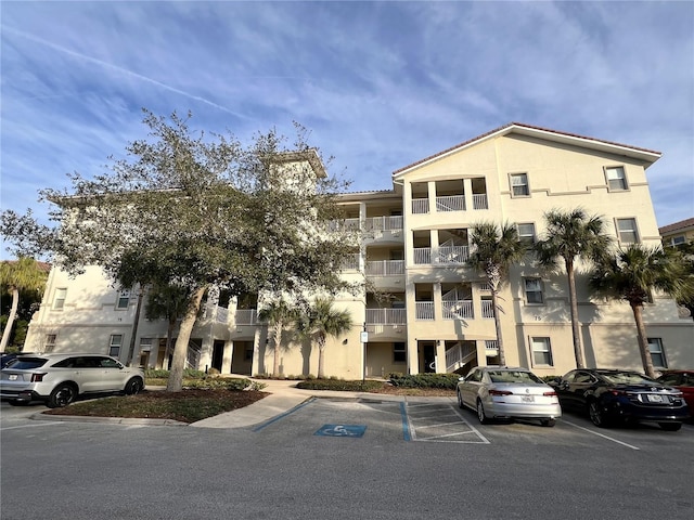 view of property with uncovered parking