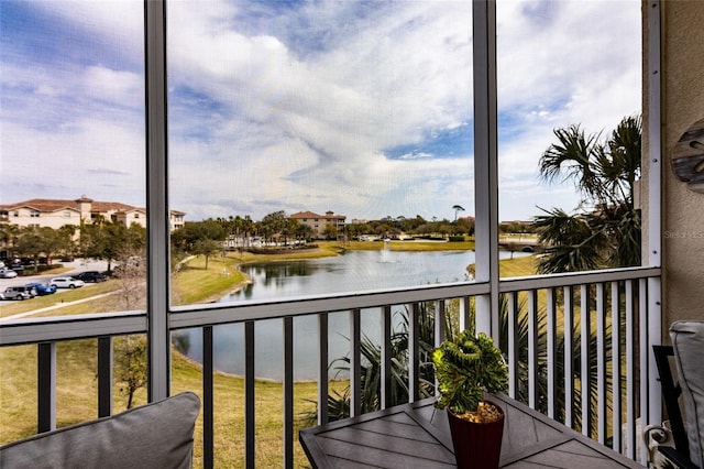 balcony featuring a water view