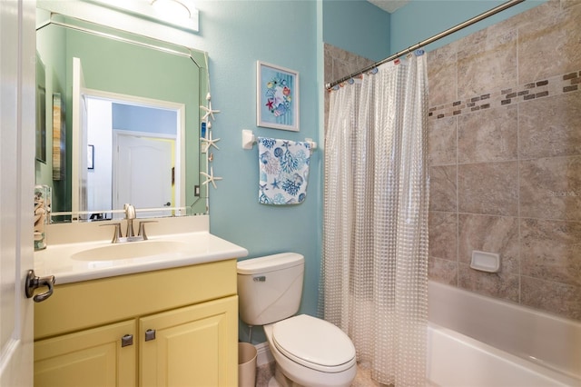 bathroom featuring shower / bath combo, vanity, and toilet