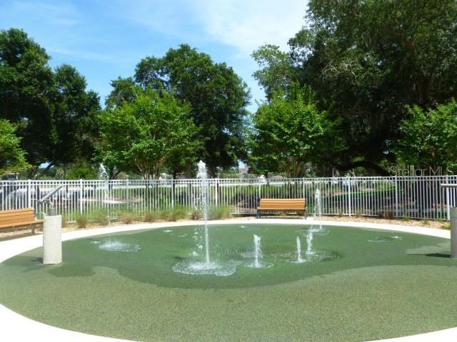 view of property's community with fence