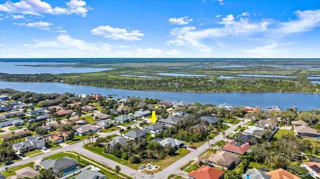 birds eye view of property featuring a water view and a residential view