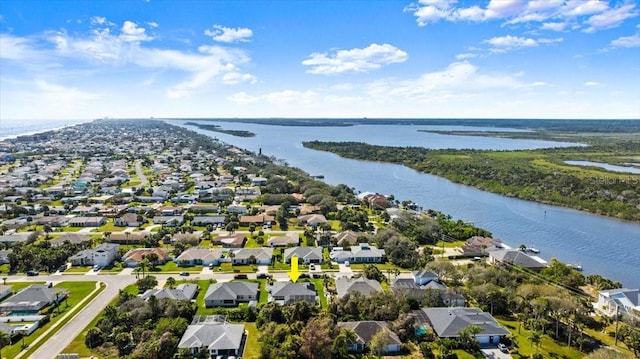 bird's eye view with a water view and a residential view