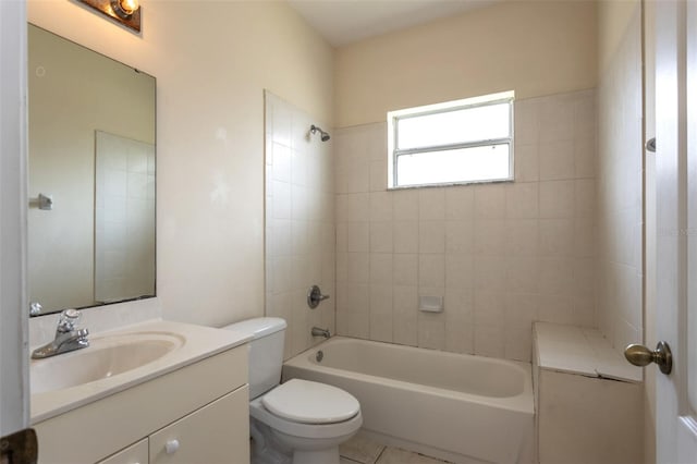 bathroom featuring toilet, tile patterned flooring, tub / shower combination, and vanity