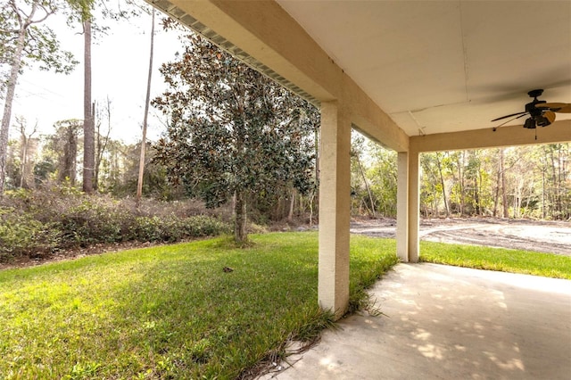 view of yard featuring a ceiling fan