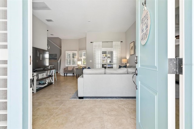 living room with light tile patterned floors